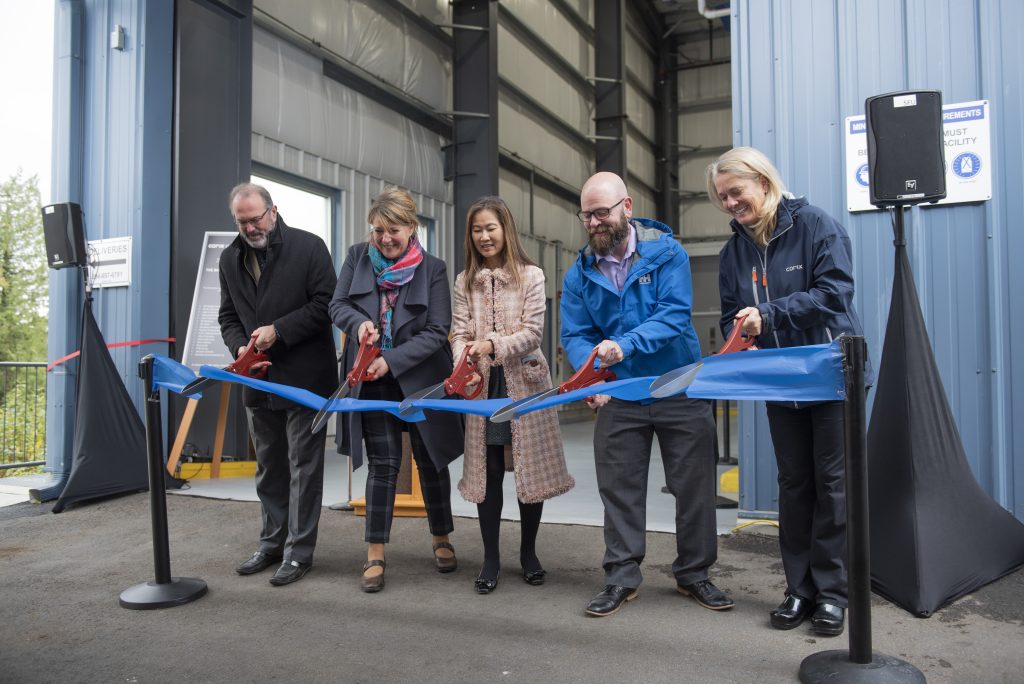 Corix employees at a ribbon cutting ceremony