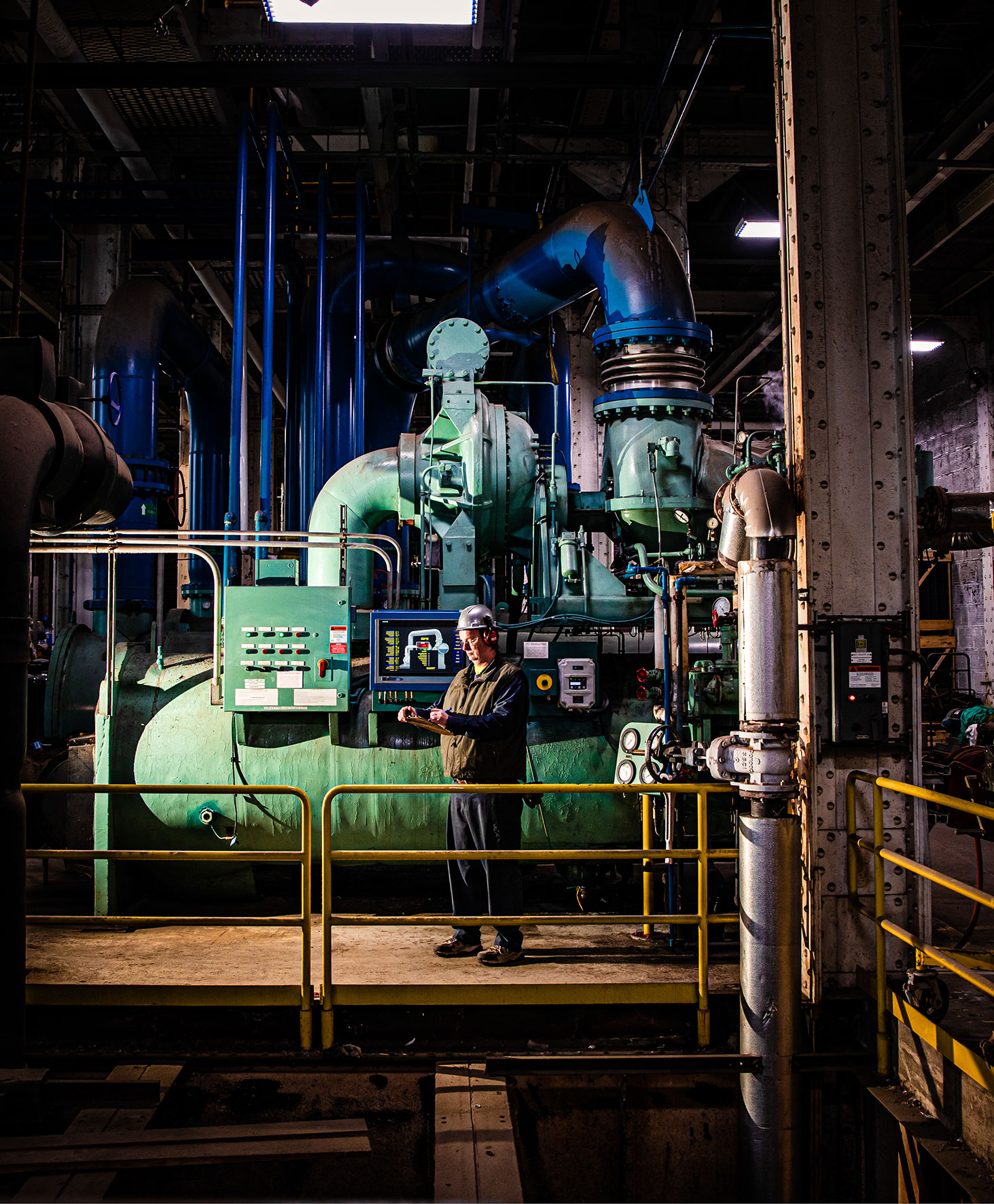 man standing in cooling facilities