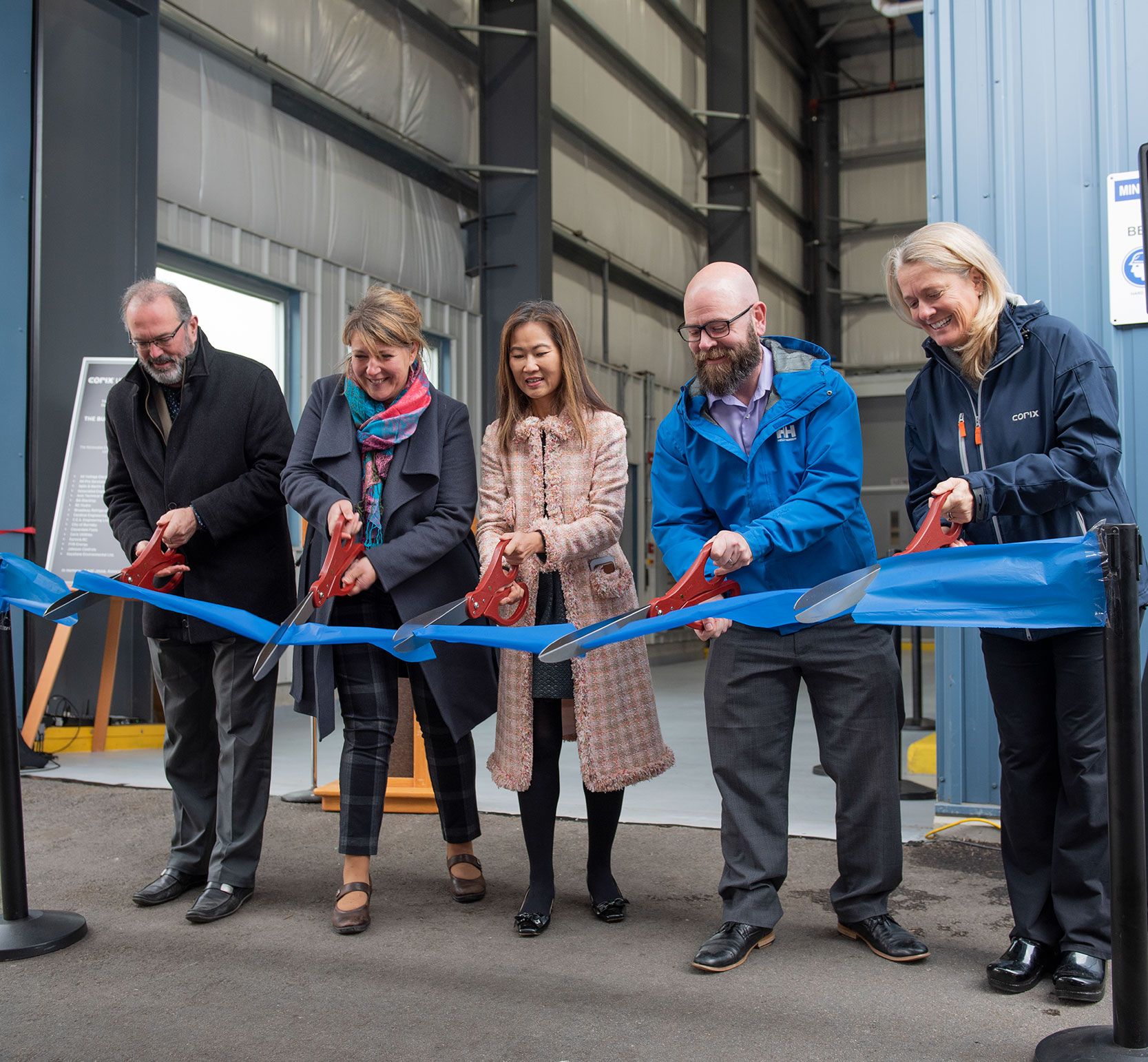 Corix employees at a ribbon cutting ceremony